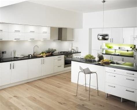 white ceramics Ikea Backsplash with white wooden kitchen cabinet having black counter… | White ...