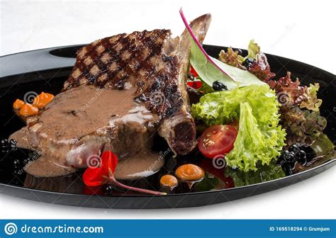 Ribeye Steak with Demi-glace Sauce on a Glossy Black Plate Stock Photo - Image of sauce, cooked ...