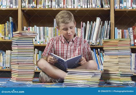 Boy Reading Book in Library Stock Photo - Image of children, book: 29662070