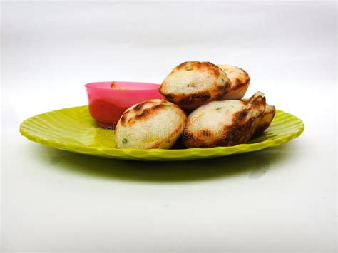 Paddu or Kuzhi Paniyaram and Coconut Chutney in a Green Plate Isolated on White Background ...