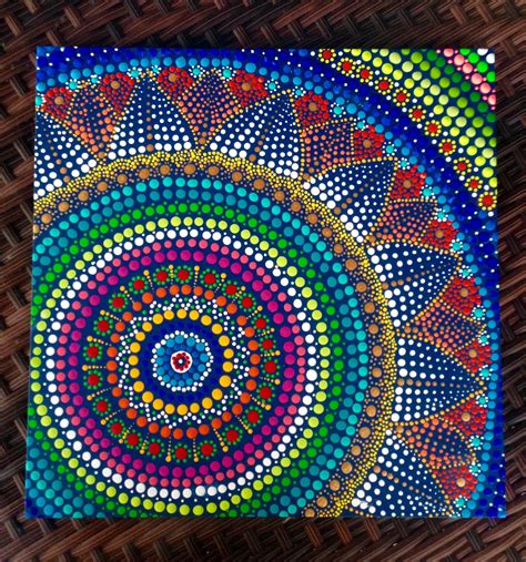 a colorful painting on top of a wooden table