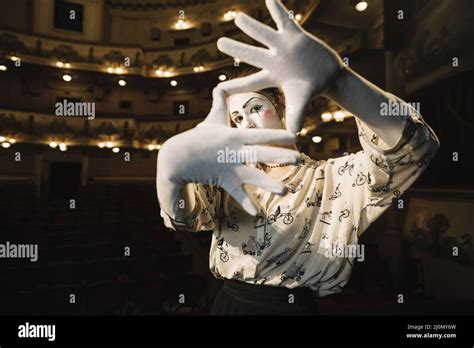 Female mime making hand frame Stock Photo - Alamy