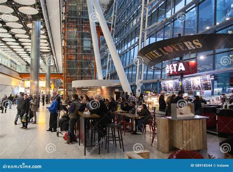 LONDON, UK - MARCH 28, 2015: People Waiting for Arrivals in Heathrow Airport Terminal 5 ...