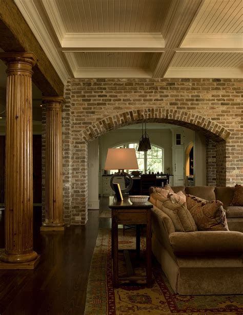 Living Room with Brick Arch, Natural Fluted Columns and Painted Wood Beams | Brick archway ...