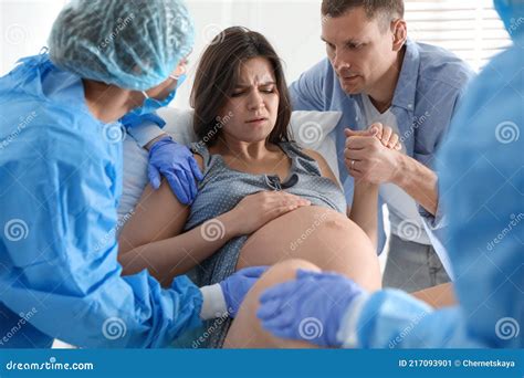 Woman Giving Child Birth in Maternity Hospital Stock Image - Image of husband, family: 217093901