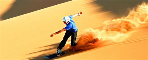 Sandboarding and skiing on Dubai desert