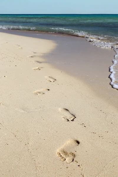 Footprints on sand beach — Stock Photo © Kokhanchikov #5216141