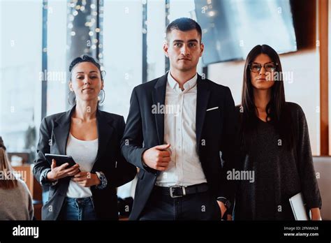 Group of successful business people standing together at office Stock Photo - Alamy