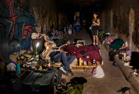 A homeless couple is pictured at home in the drainage tunnels near Dean ...