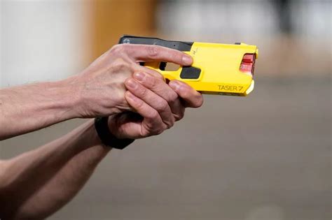 Ayrshire police taser woman holding scissors to throat as weapon used ...