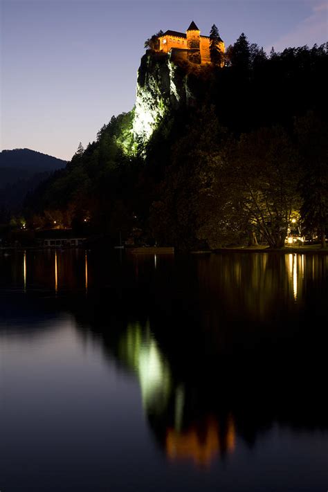 Lake Bled castle reflected at dusk Photograph by Ian Middleton - Pixels