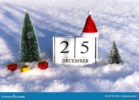 Christmas Concept. December 25 Calendar Numbers and Santa Hat on Snow Background with Lights ...