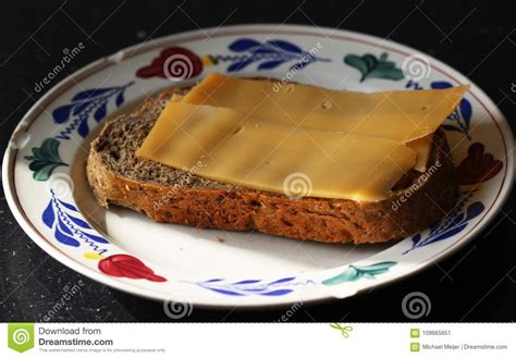 Slice of Bread with Cheese on a Plate in Kitchen Stock Image - Image of drink, gourmet: 109665851