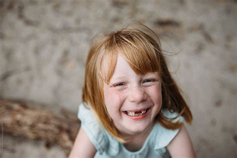 "Portrait Of A Little Girl Missing Her Two Front Teeth" by Stocksy Contributor "Amanda Voelker ...