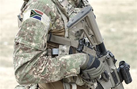 Soldier with Assault Rifle and Flag of South Africa on Military Uniform ...