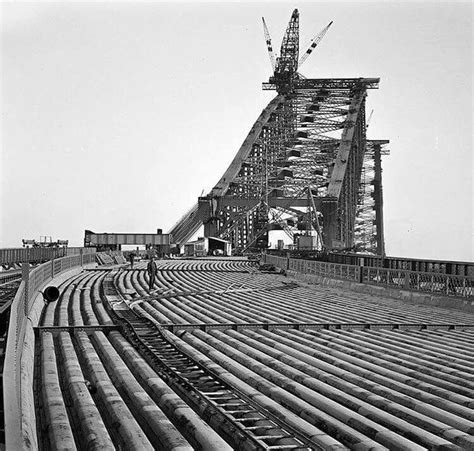 Workmen laying down the foundations for the road leading to the Sydney Harbour Bridge in late ...