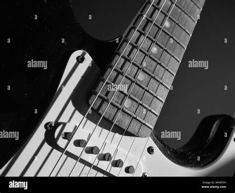 Close up shot of an electric guitar in black and white Stock Photo - Alamy