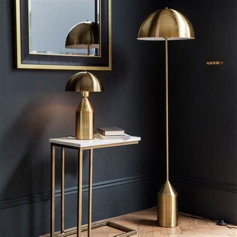 Albany Gold Floor Lamp Stylish floor lamp with a metal frame in a gold finish Featuring a half ...