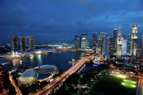 Singapore City Skyline At Dusk by Raisbeckfoto