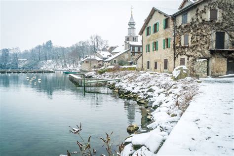 Yvoire village with snow stock image. Image of tree - 106524199