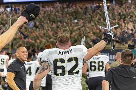 The U.S. Military Academy (Army) football team celebrates a win over ...