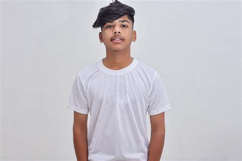 Handsome Indian young boy wearing white t-shirt. 5427577 Stock Photo at ...