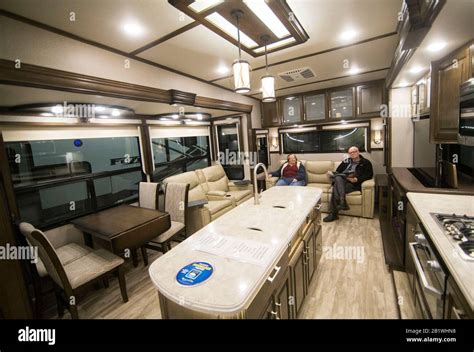 Toronto, Canada. 27th Feb, 2020. People look at the interior of a luxury RV during the 2020 ...