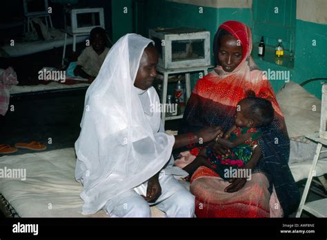 Geneina Sudan Nurse With Chadean Refugee Mother & Child Stock Photo - Alamy