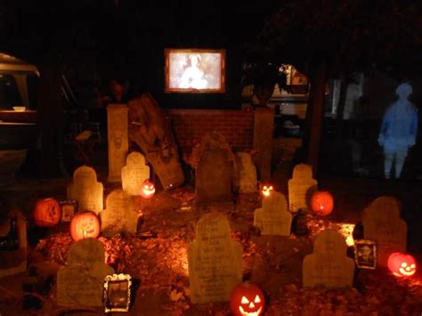 The graveyard, ghost on right, and picture projected above graveyard wall. Scary stuff!! | Ghost ...