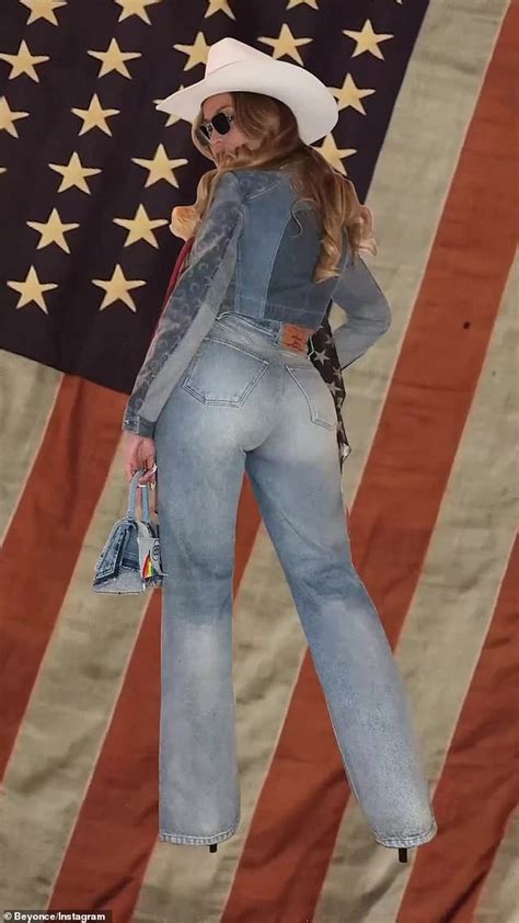 Beyonce rocks double denim and cowboy hat with American flag scarf ahead of Cowboy Carter album ...