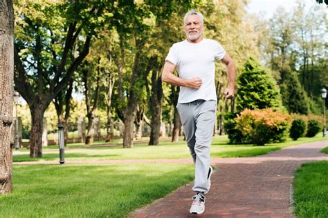 Full shot old man running outdoors | Free Photo