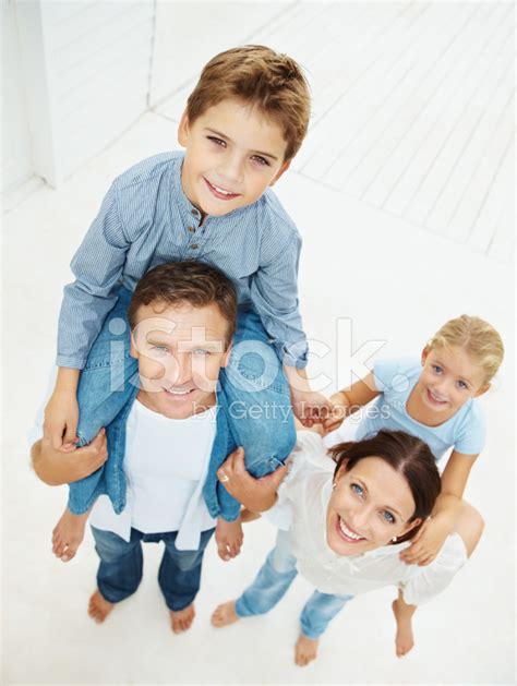 Happy Parents Carrying Their Children On Shoulders Stock Photo | Royalty-Free | FreeImages