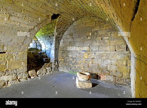 English Heritage Warkworth Castle guardroom Stock Photo - Alamy