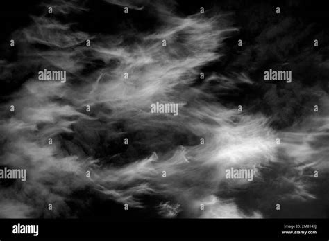Cirrus Uncinus clouds in a blue sky Stock Photo - Alamy