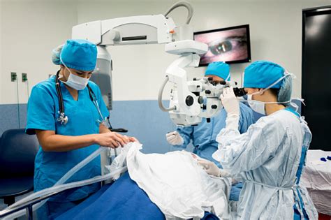 Ophthalmic Surgeon Performing An Eye Surgery At The Hospital Stock ...