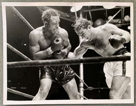 MARCIANO, ROCKY-ARCHIE MOORE ORIGINAL WIRE PHOTO (1955) – JO Sports Inc.