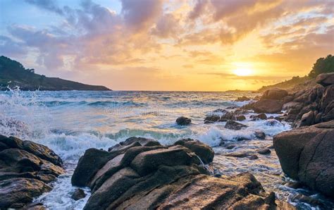 Sunset Of The Sea With Rocks And Mountain In The Background. Beach And Sea Water With Long ...