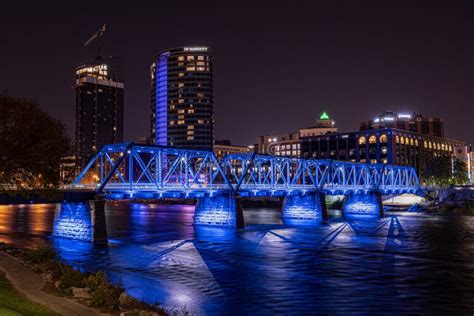 Grand Rapids, Michigan USA - October 9 -2020: Blue Bridge of Downtown Grand Rapids Glows Vibrant ...