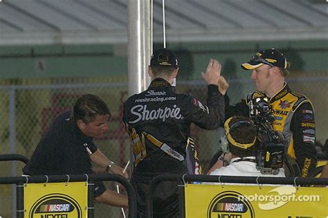 2004 NASCAR NEXTEL Cup champion Kurt Busch and Matt Kenseth change the ...