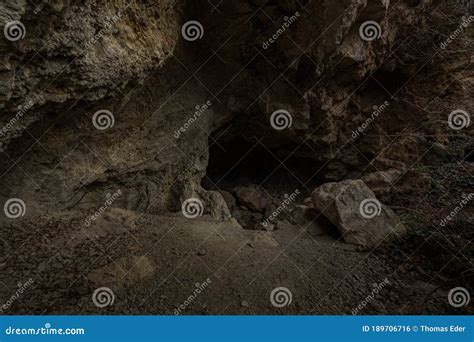 Dark Sea Cave Under Cliffs In Greece Royalty-Free Stock Photo ...