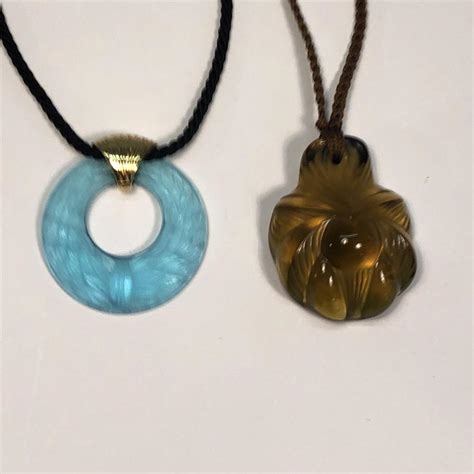 Lot - Two Lalique glass pendants