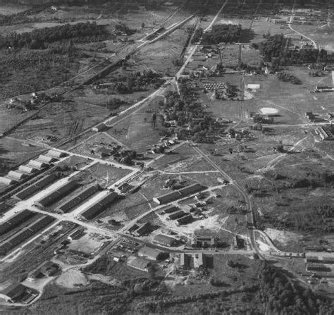 Fort Knox military base, Fort Knox, Kentucky, 1935. Aerial view of trees, roads, barracks, and ...