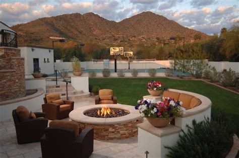 Perfect for entertaining! Backyard with a fire pit and basketball court ...