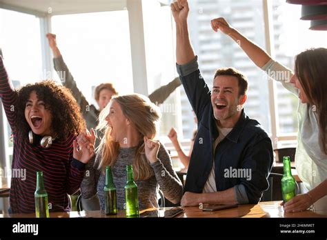 Excited business people celebrating in office Stock Photo - Alamy