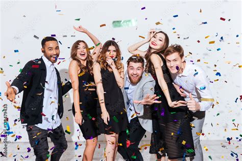 Group of happy young people celebrating and having fun together Stock Photo | Adobe Stock