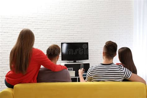 Group Of Young People Resting On The Couch In The Living Room. Stock Photo - Image of laptop ...