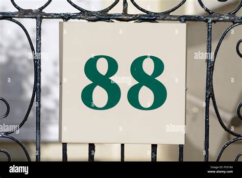 House number 88 sign on gate Stock Photo - Alamy