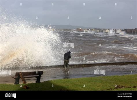 Scotland, Ayrshire, Prestwick, Storm Ciara 02 Feb 2020 A lone fsherman angler battles waves ...