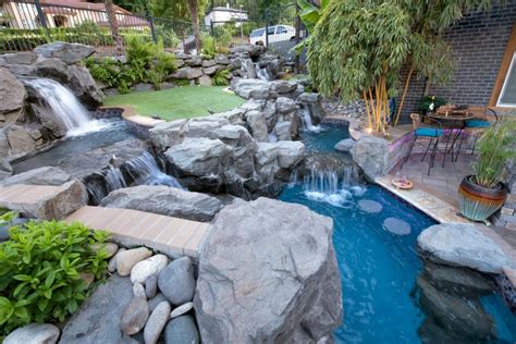 Tropical Backyard Boasts Rock Waterfall and Stream | HGTV's Ultimate ...