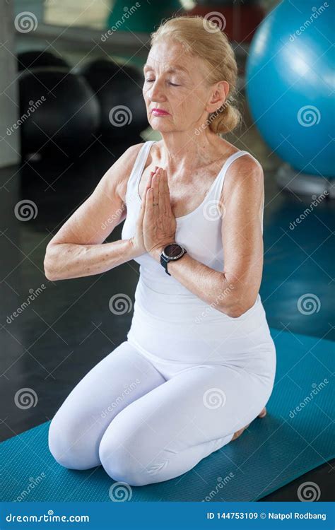 Senior Woman Doing Yoga in Fitness Gym. Aged Lady Exercising. Old ...